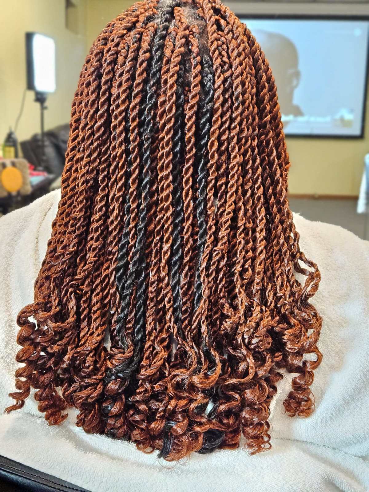 Close-up of finely woven Senegales Twist with curls.